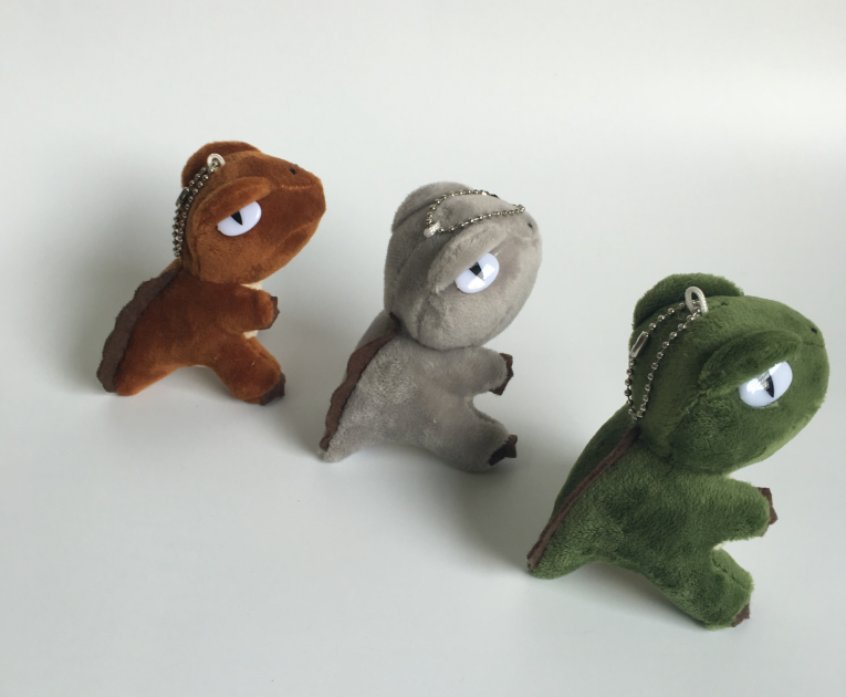 Cute dinosaur plush toy ā side view
