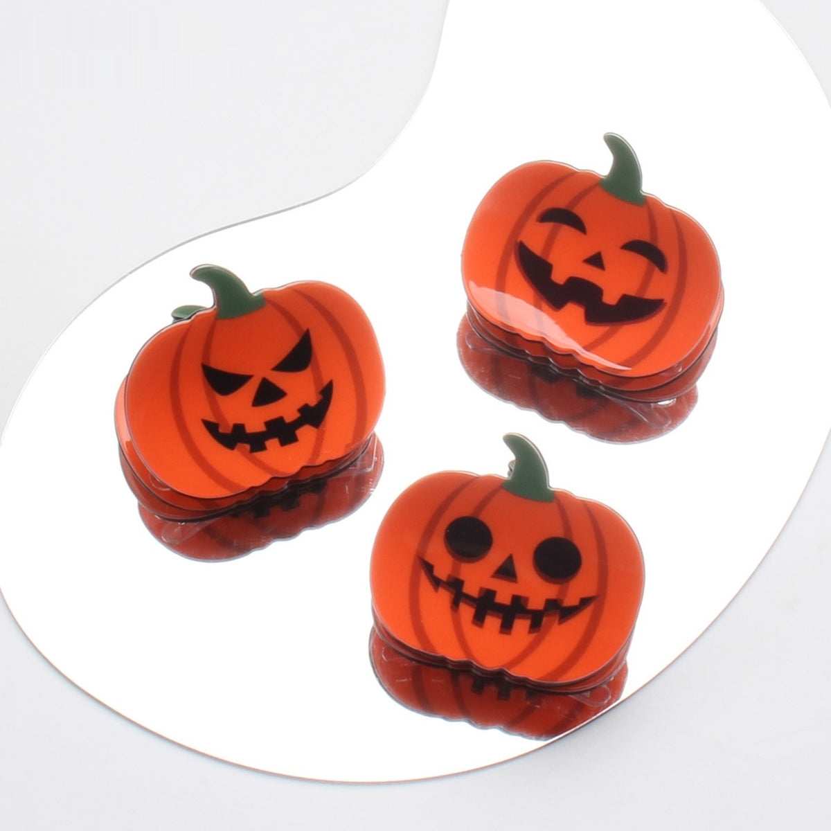Picking And Playing With Funny Pumpkin Discs With Hair Clips — back view