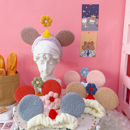 Small flower headband with cat ears — in use
