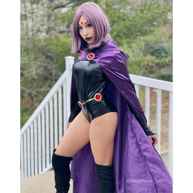 Raven Teen Titans cosplay worn on location — purple hooded cloak, black bodysuit, gold gem belt and lilac wig
