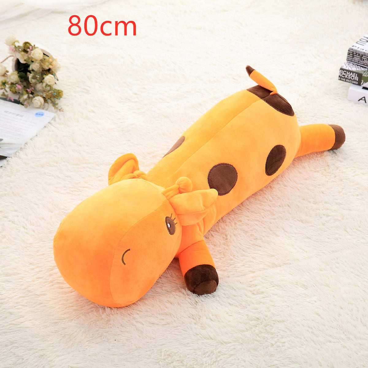 Giraffe plush toy — back view