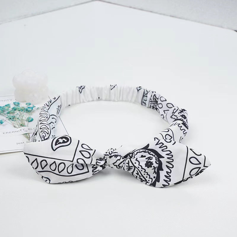 Bunny ears knotted elastic headband — back view