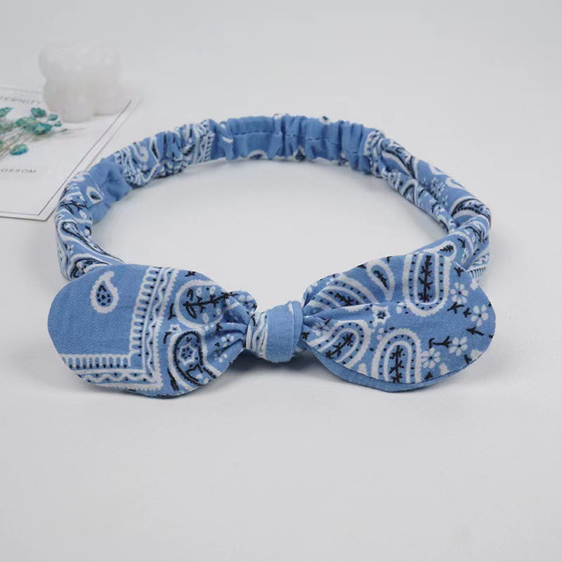 Bunny ears knotted elastic headband — scale reference
