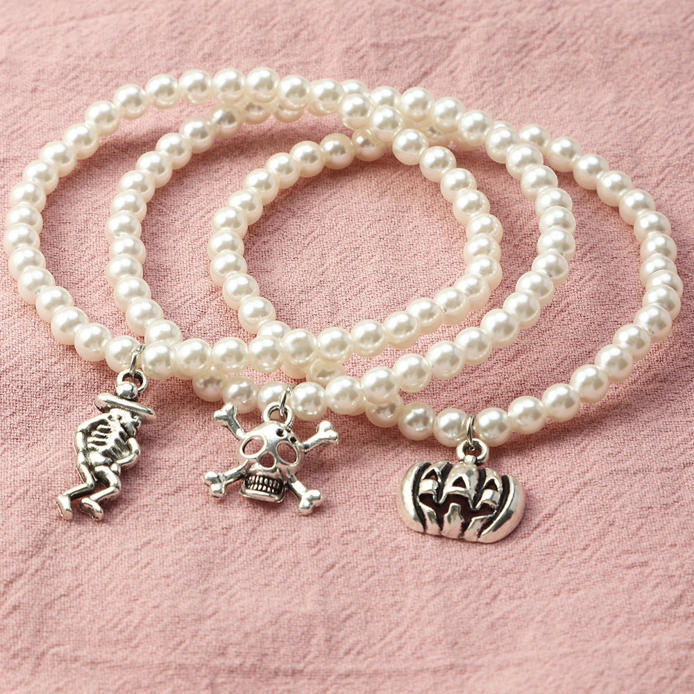 Halloween Gothic Jewellery 3-Piece — Vintage Skull Tassel Necklace, Imp Pearl Bracelet & Cartoon Pumpkin Bracelet — back view
