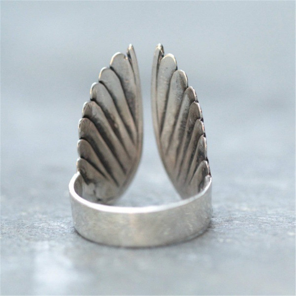 Angel wings ring black angel wings — side view