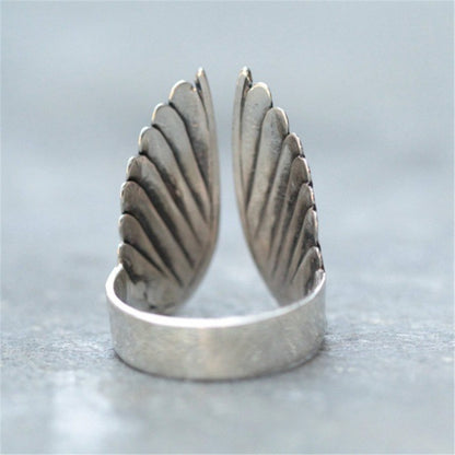 Angel wings ring black angel wings — side view