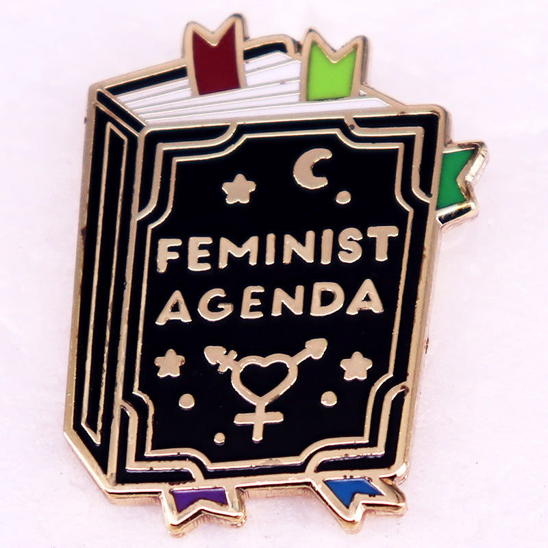 Book And Cup Hard Enamel Pin Fantasy Novel Badge — in use