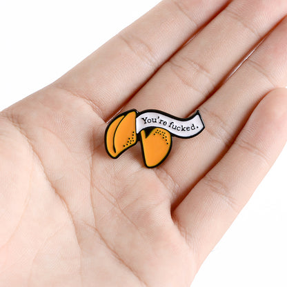 Enamel pin with cartoon fortune cookie dripping oil — packaging