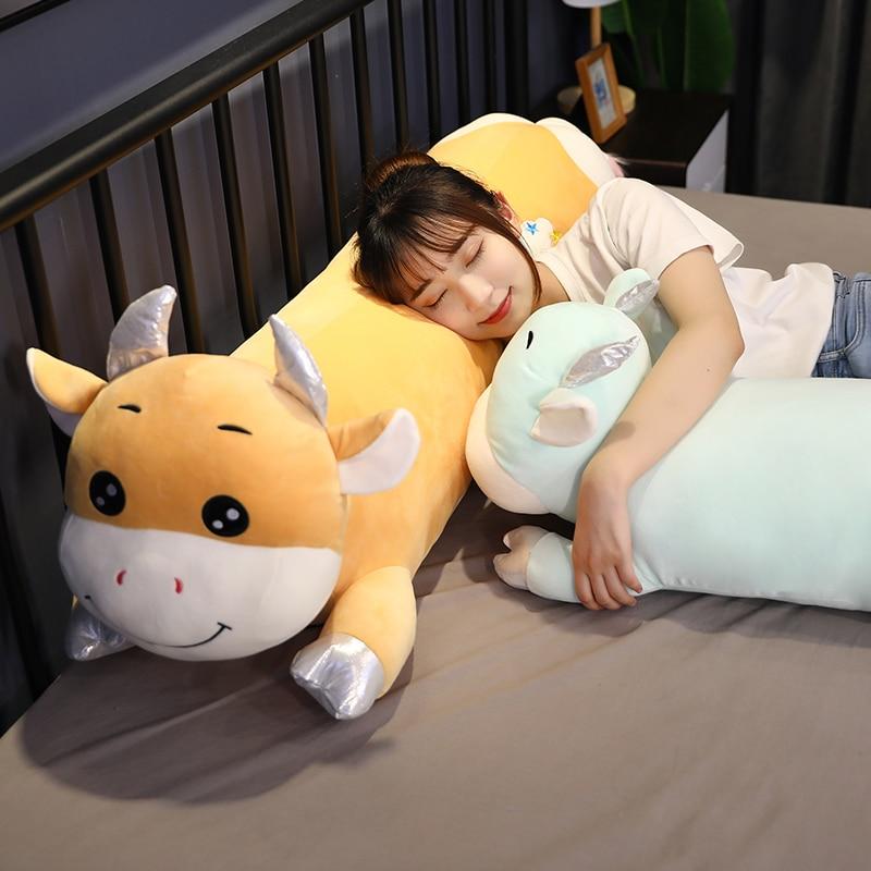 Clouds lying cow plush toy — side view