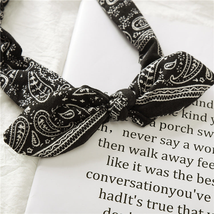 Bunny ears knotted elastic headband — side view