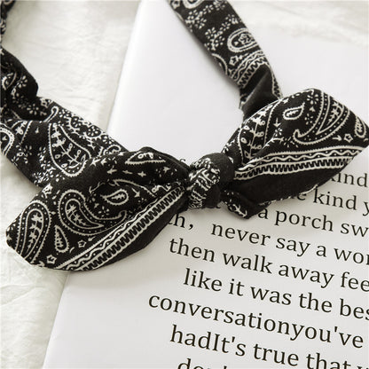 Bunny ears knotted elastic headband — side view