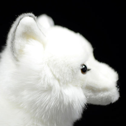 Arctic fox plush doll — in use