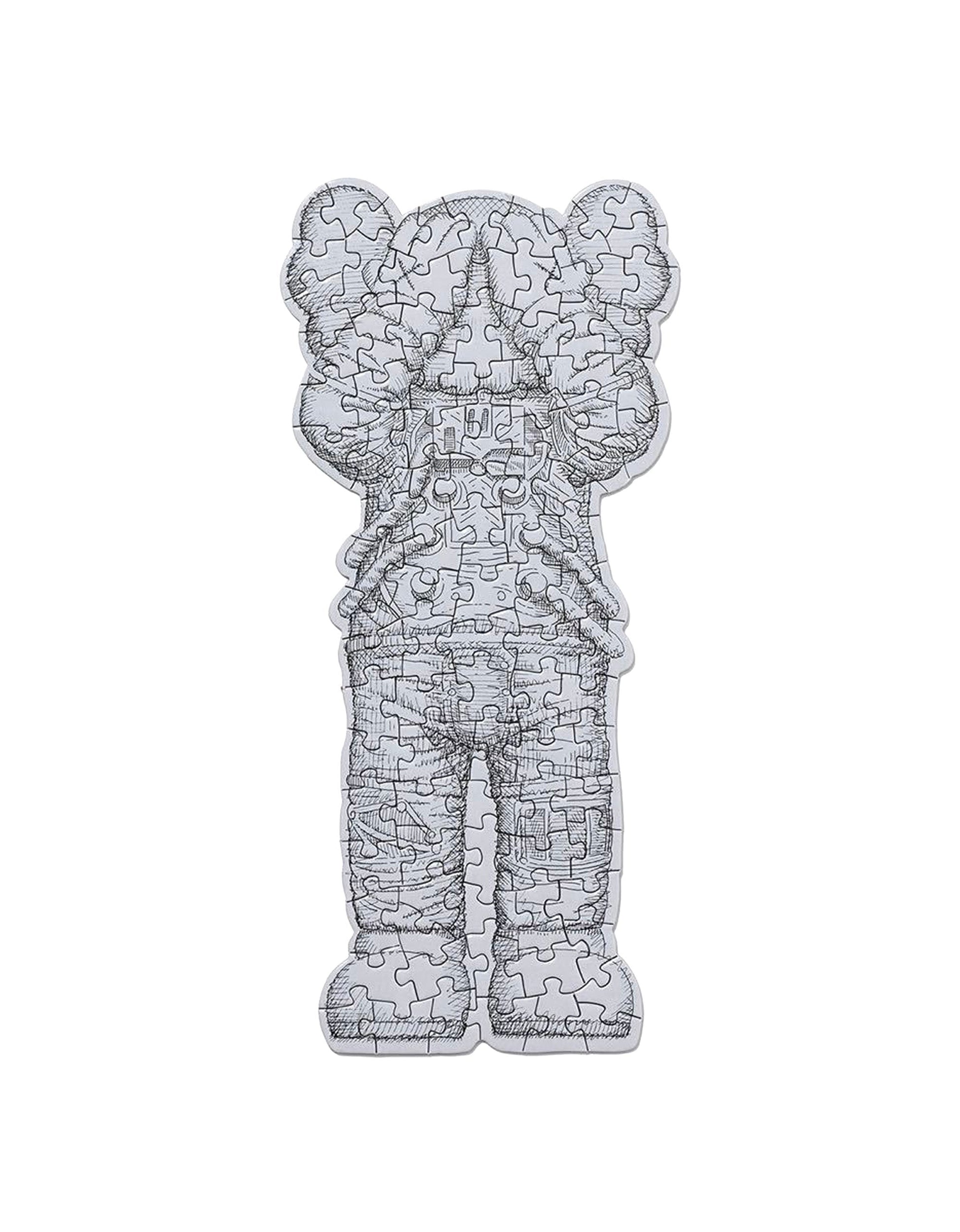 KAWS Paper Goods Duo — WHAT PARTY Booklet + Tokyo First Space Holiday Puzzle — back view