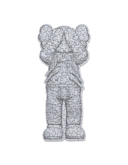 KAWS Paper Goods Duo — WHAT PARTY Booklet + Tokyo First Space Holiday Puzzle — back view