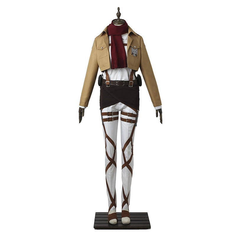 Mikasa Ackerman cosplay outfit laid out — tan jacket, red scarf, harness belt, wrapped skirt and strapped white trousers